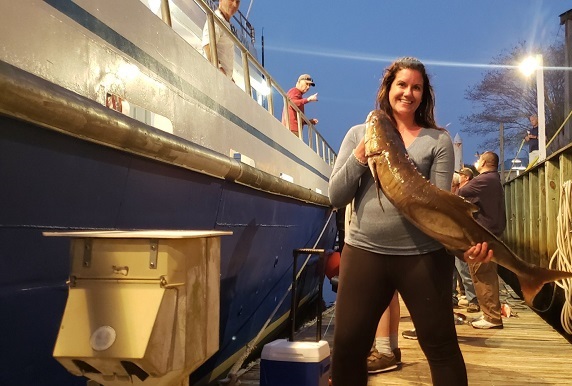 deep sea fishing charter a woman standing on a boat