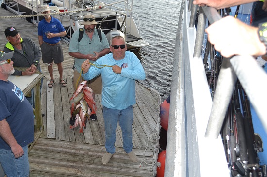 fishing Myrtle Beach a group of people standing on a dock