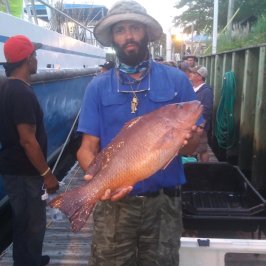 a man holding a fish
