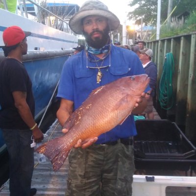 a man holding a fish