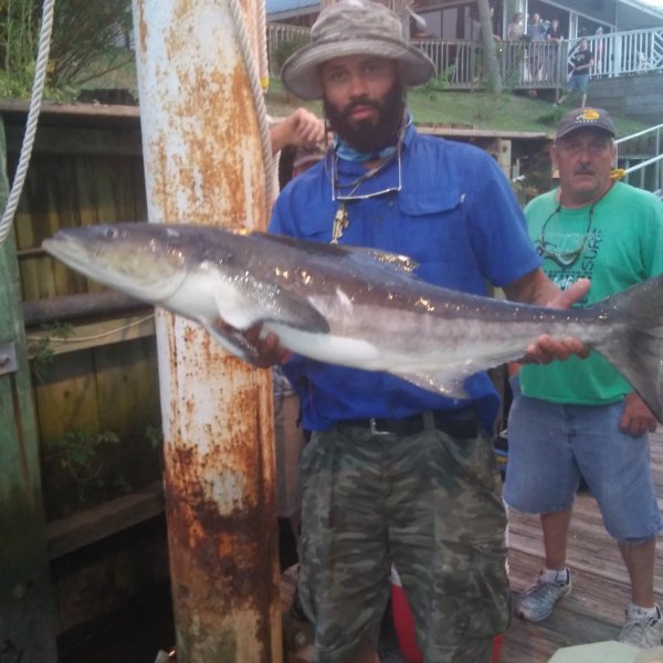 a man holding a fish