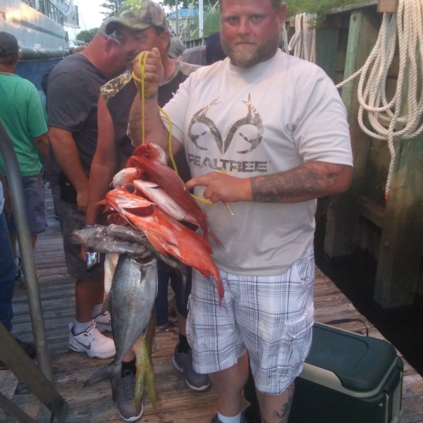 a man holding a fish