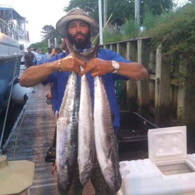 a man holding a fish