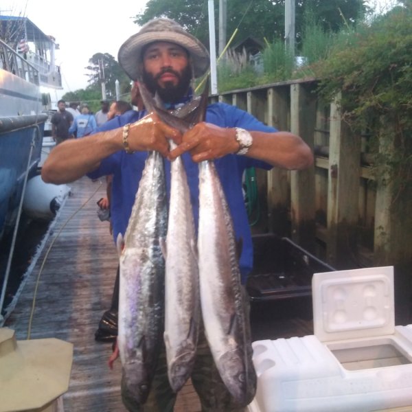 a man holding a fish