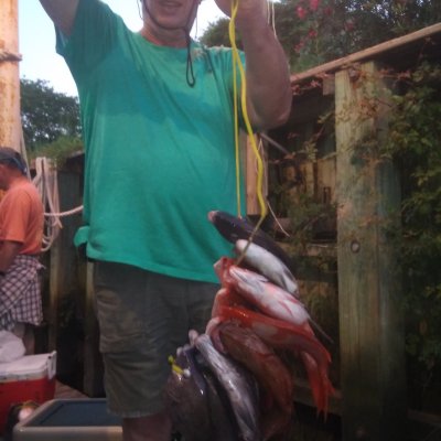 a man holding a fish