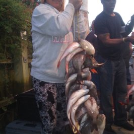 a man holding an animal