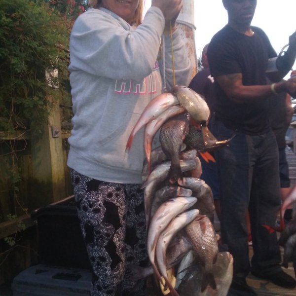 a man holding an animal