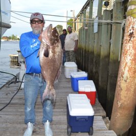 a person standing next to a dock