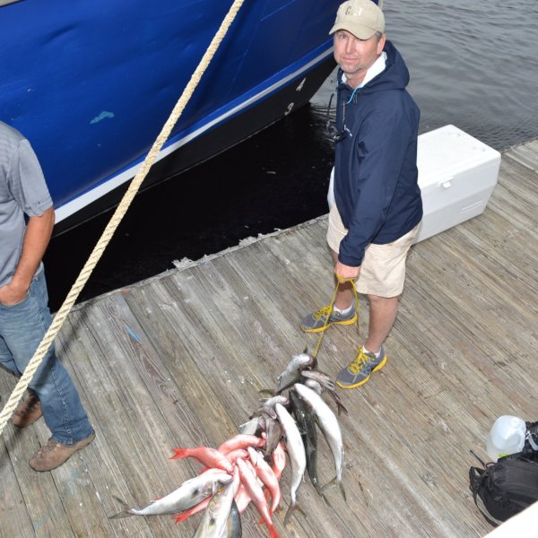a group of people on a boat in the water