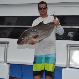 a man holding a fish