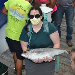 a man holding a fish