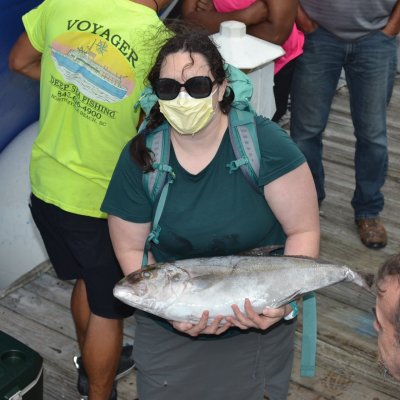 a man holding a fish