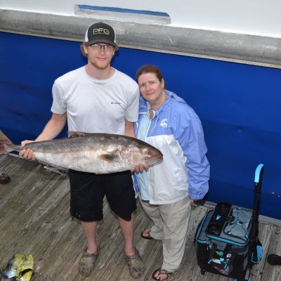 a man holding a fish