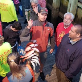 a group of people standing in front of a crowd