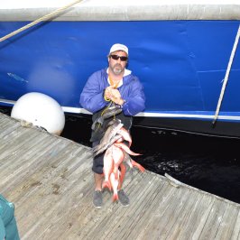 a man sitting on a boat