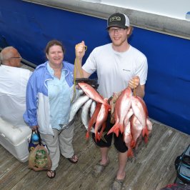 a man holding a fish