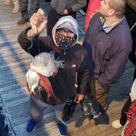 a group of people standing around each other