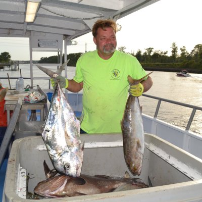 a man holding a fish