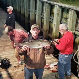 a person holding a fish