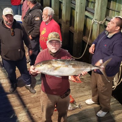 a person holding a fish