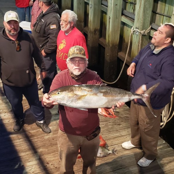 a person holding a fish