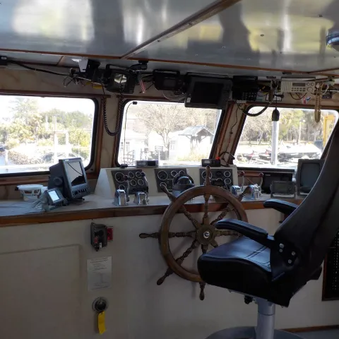 a view of a kitchen next to a window