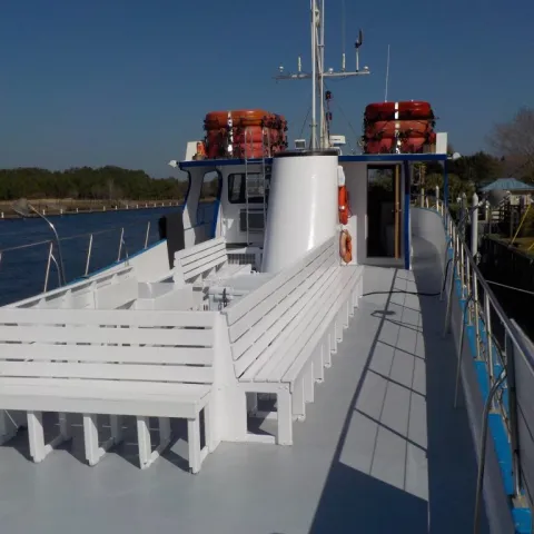 a boat is docked next to a body of water