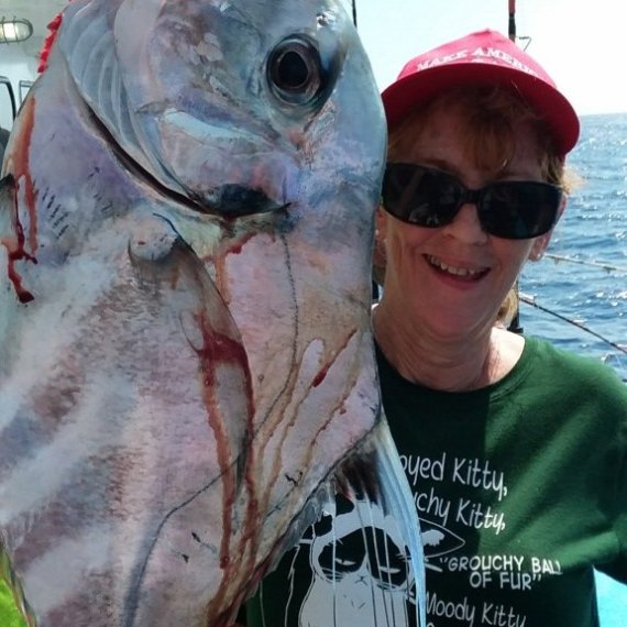 a person holding a fish