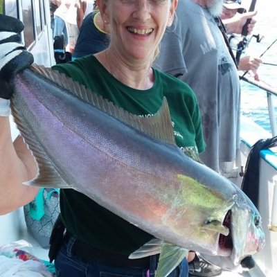 a person holding a fish