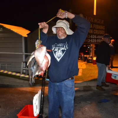a person holding a fish