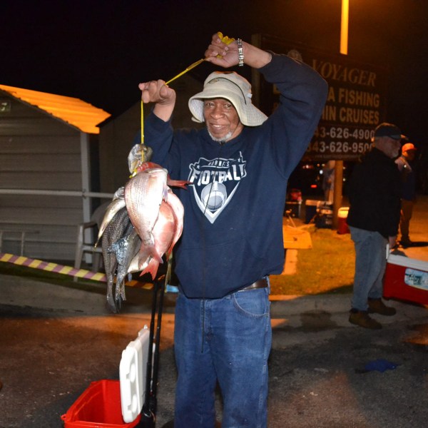 a person holding a fish