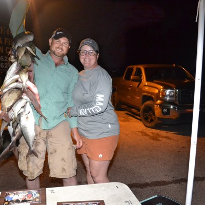 a person holding a fish