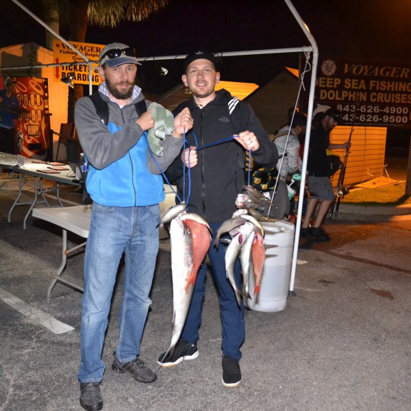 a person holding a piece of luggage