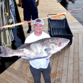 a person holding a fish