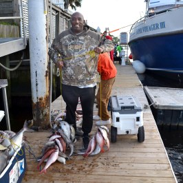 a man standing next to a boat