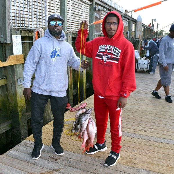 a man standing on a sidewalk