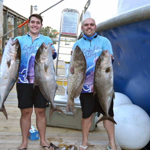 a person holding a fish