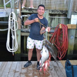 a person holding a fish