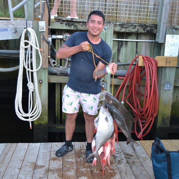 a person holding a fish