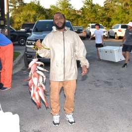 a man standing in a parking lot