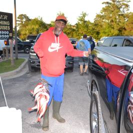a person standing next to a car