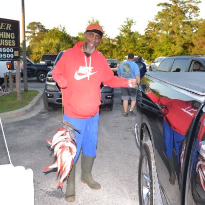 a person standing next to a car
