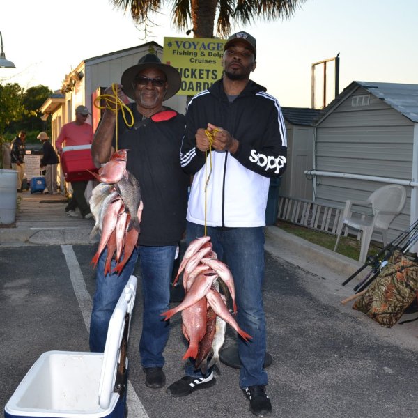 a man standing next to a woman