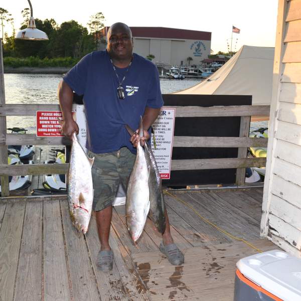 a man holding a fish