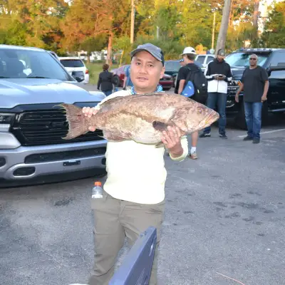a man standing next to a car
