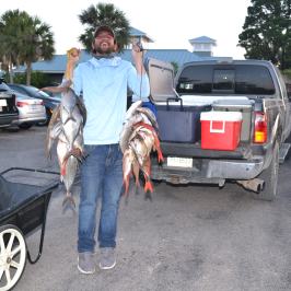 a person standing in a parking lot next to a car