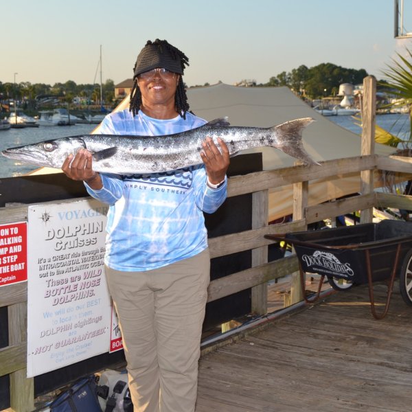 a person standing in front of a boat