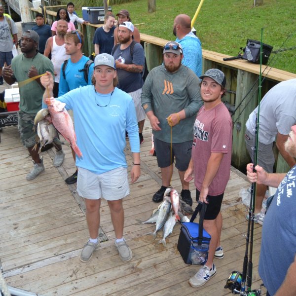 a group of people standing in front of a crowd