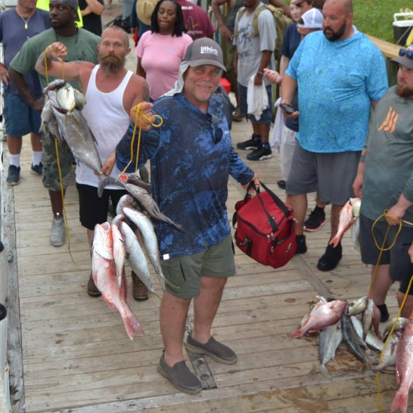 a group of people walking down a fish
