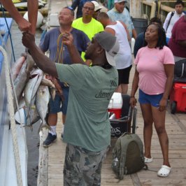 a group of people standing in front of a crowd